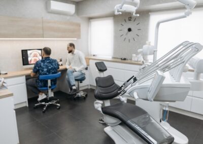 Dental professionals discussing patient images in a modern clinic setting.